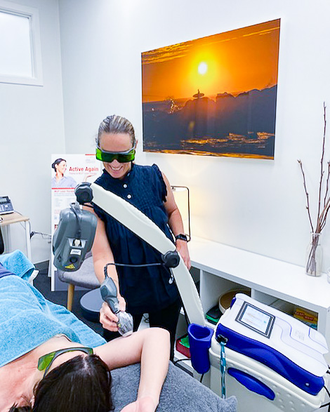 Kate performing MLS Laser Therapy